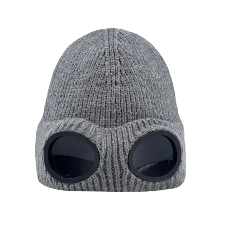 A gray ribbed knit beanie hat with two large black oval visor-like cutouts on the front, shown against a plain white background.