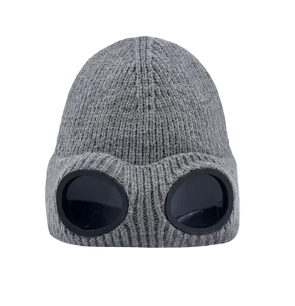 A gray ribbed knit beanie hat with two large black oval visor-like cutouts on the front, shown against a plain white background.